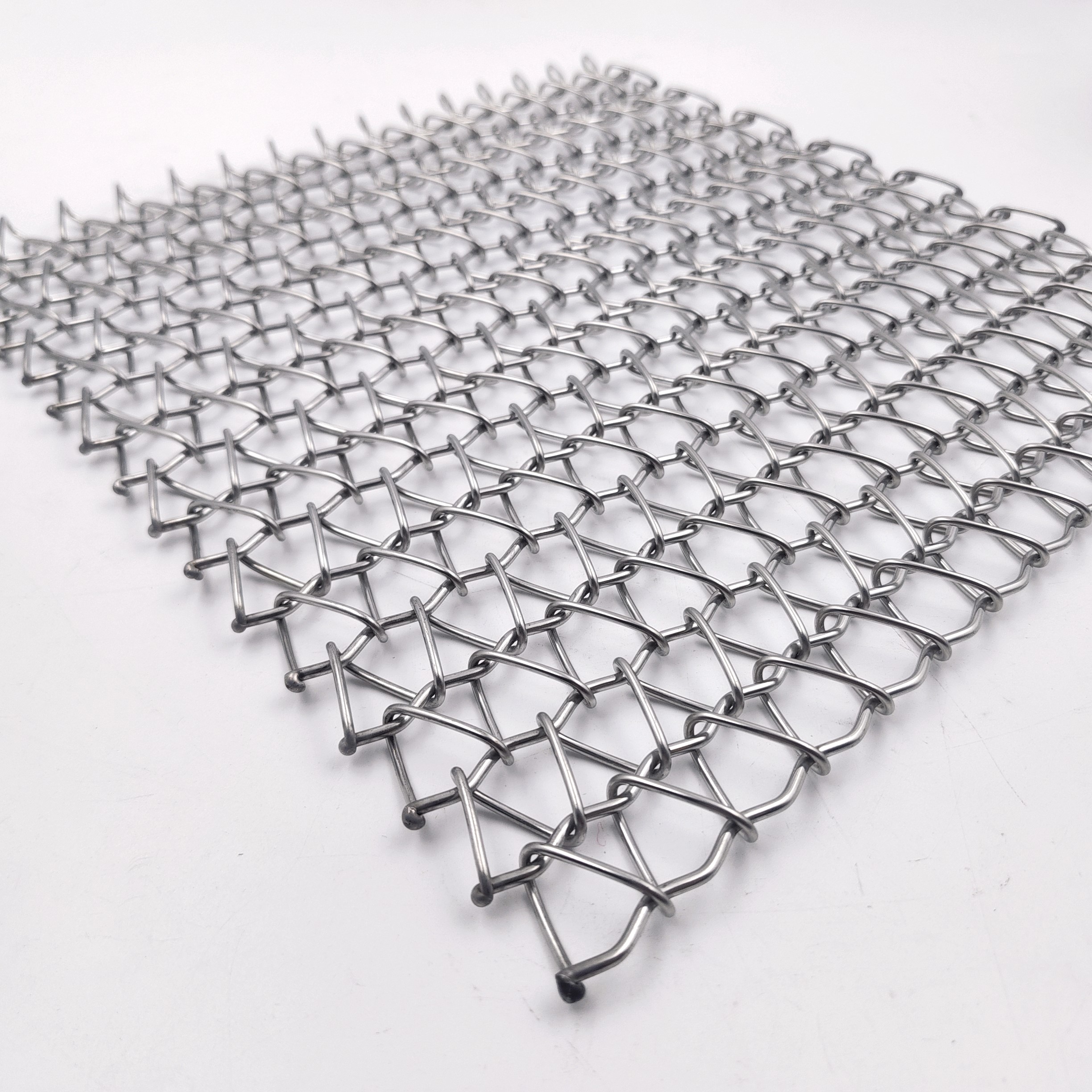 Balanced weave conveyor belt alternating spiral structure