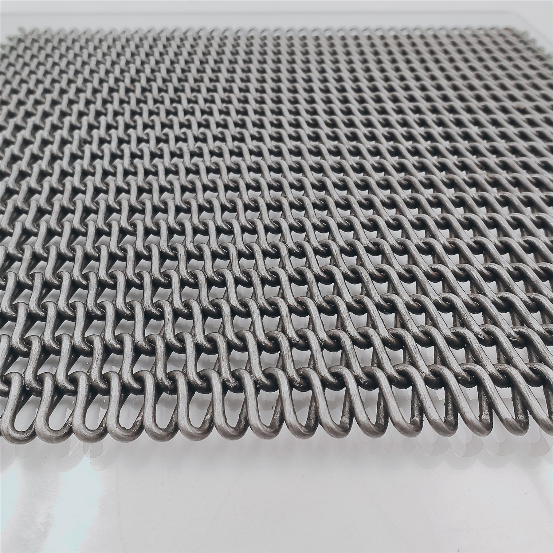 Biscuit belt spiral wire surface detail